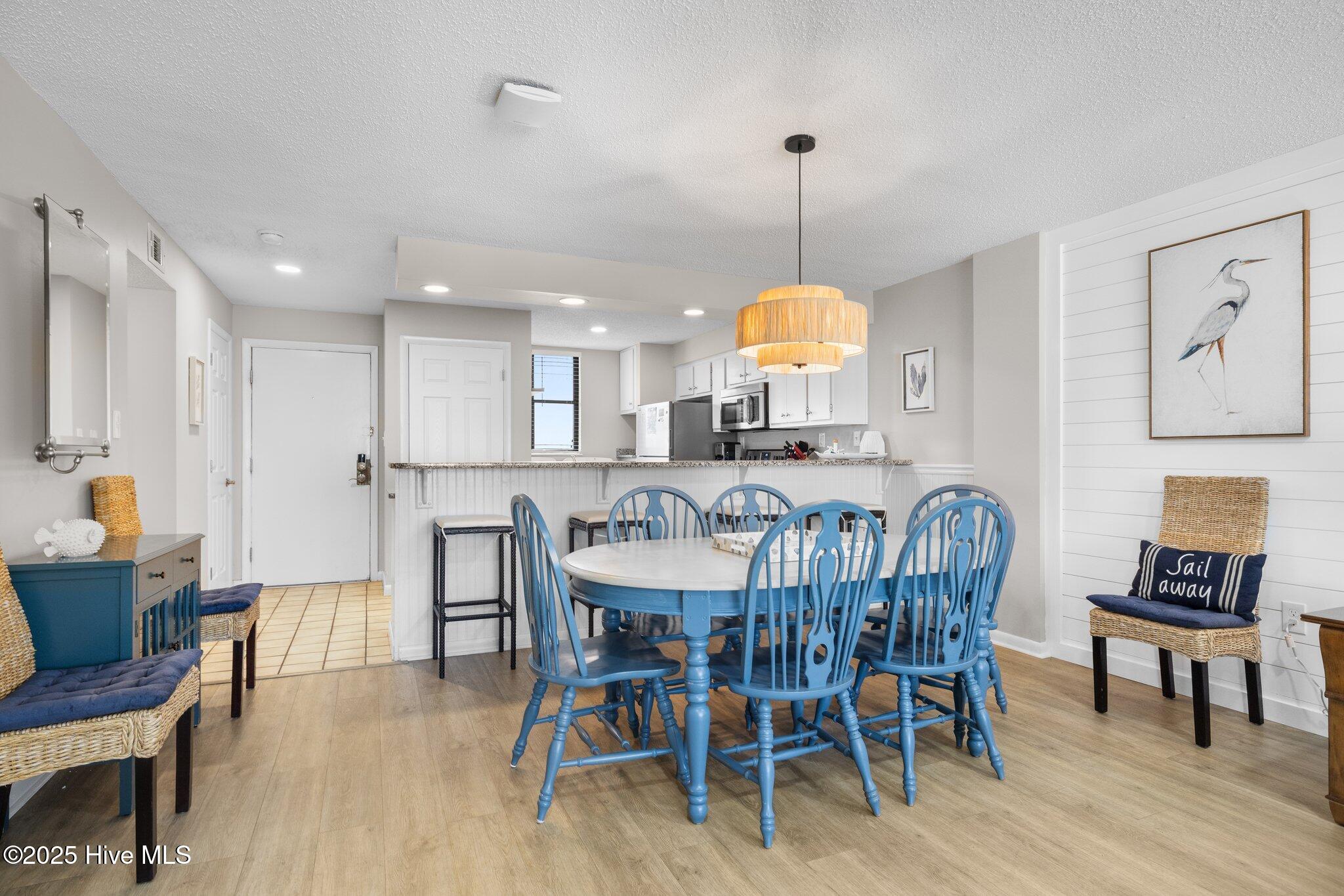 1505 Salter Path Road, Unit 409 Indian Beach, NC 28512 - Photo 10 of 35 Dining and Kitchen Space