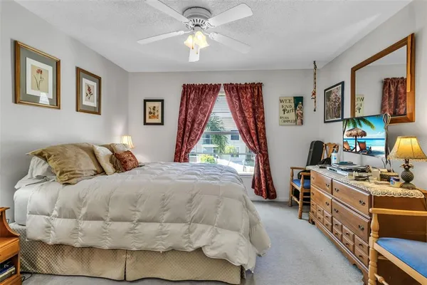 a bed room with a bed and a window