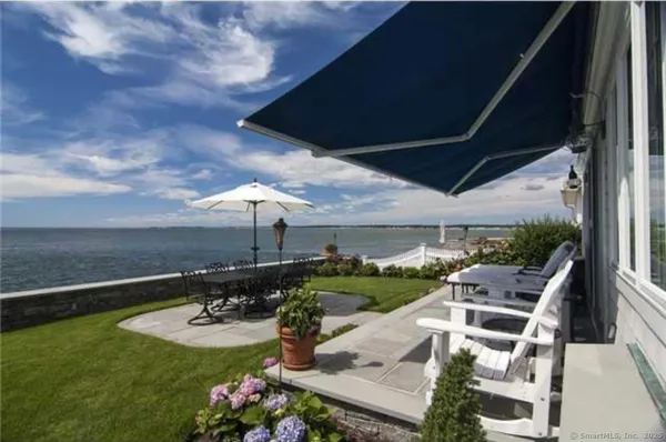 an aerial view of a house with garden space and street view