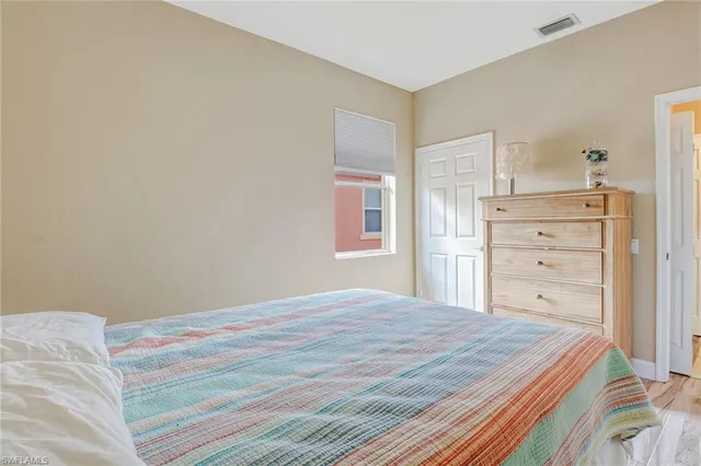 a bedroom with a bed and a closet
