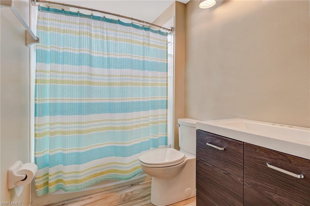 10037 Heather Lane, Unit 4 Naples, FL 34119 - Photo 17 of 24 a bathroom with a sink and a toilet