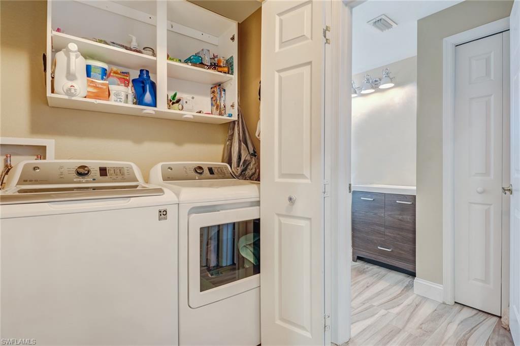 10037 Heather Lane, Unit 4 Naples, FL 34119 - Photo 18 of 24 a view of washer and dryer