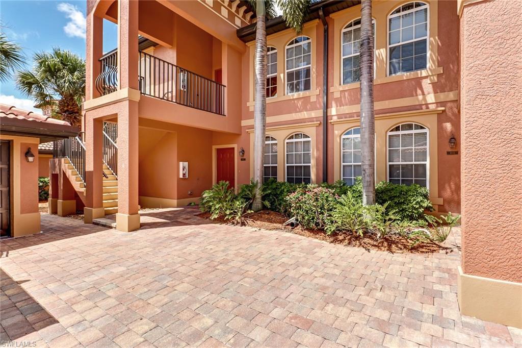 10037 Heather Lane, Unit 4 Naples, FL 34119 - Photo 22 of 24 a view of a building with potted plants