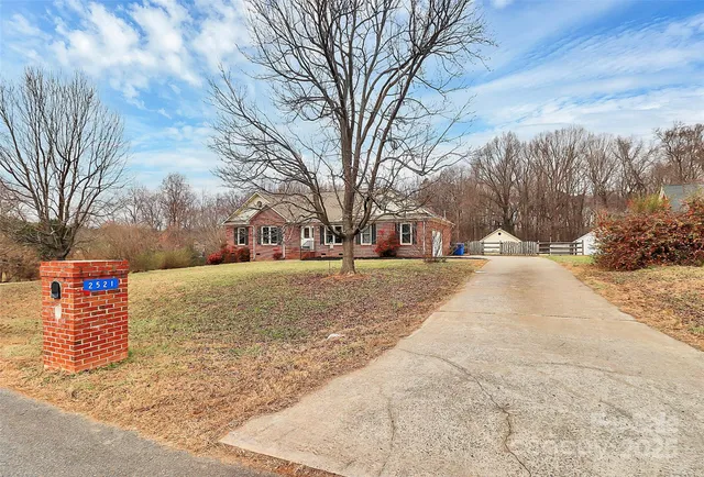 a street view covered with snow and trees