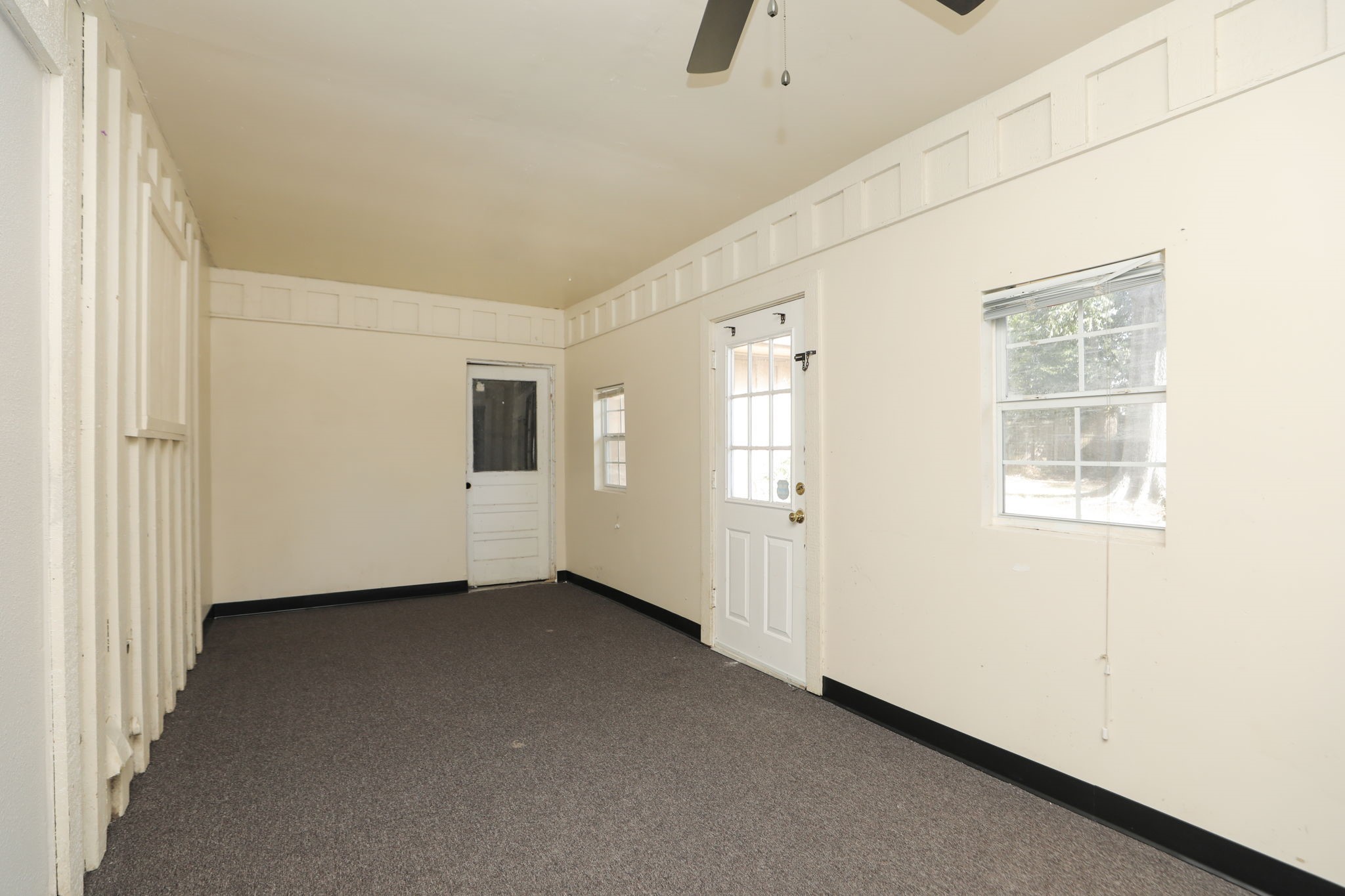 8235 Dover Street Houston, TX 77061 - Photo 18 of 36 an empty room with windows