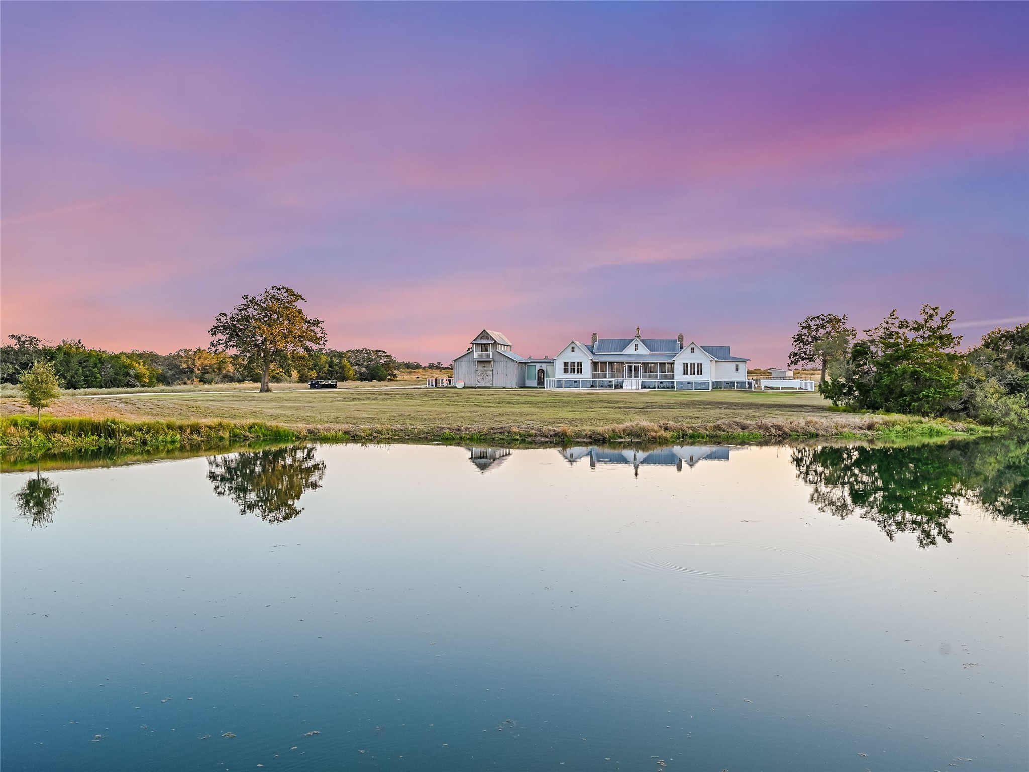 a view of a lake with houses in the background
