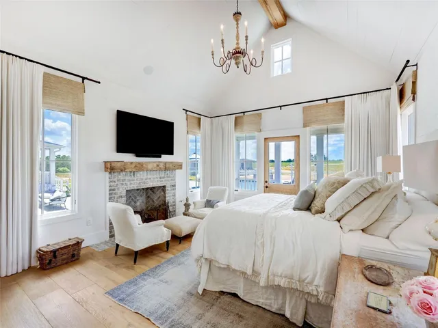 a bedroom with a bed and a fireplace