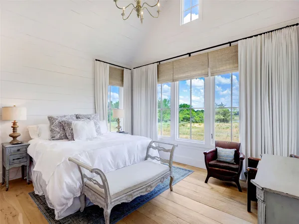 a bedroom with a bed and a couch