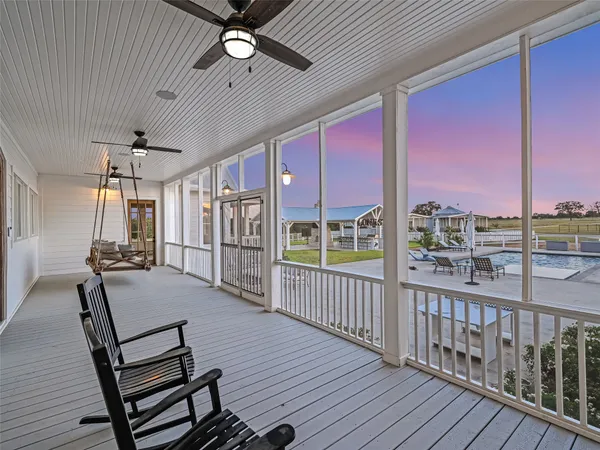 a view of a balcony with furniture