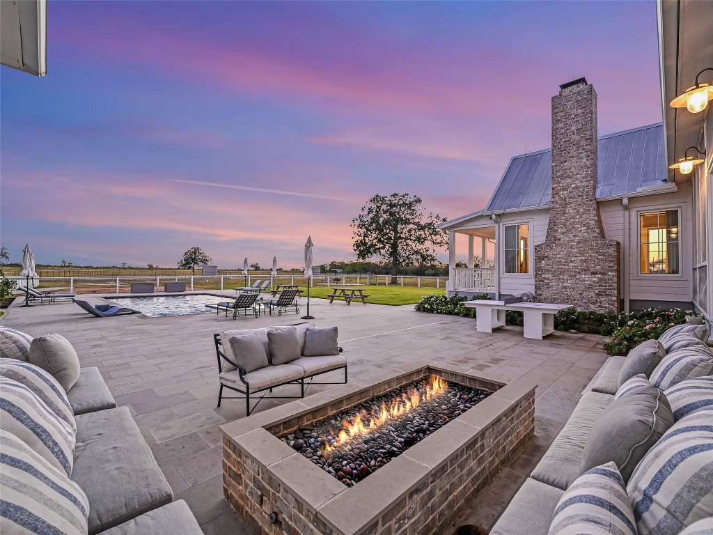 314 Big Sky Ranch Road Smithville, TX 78957 - Photo 24 of 40 a view of a roof deck with couches and potted plants