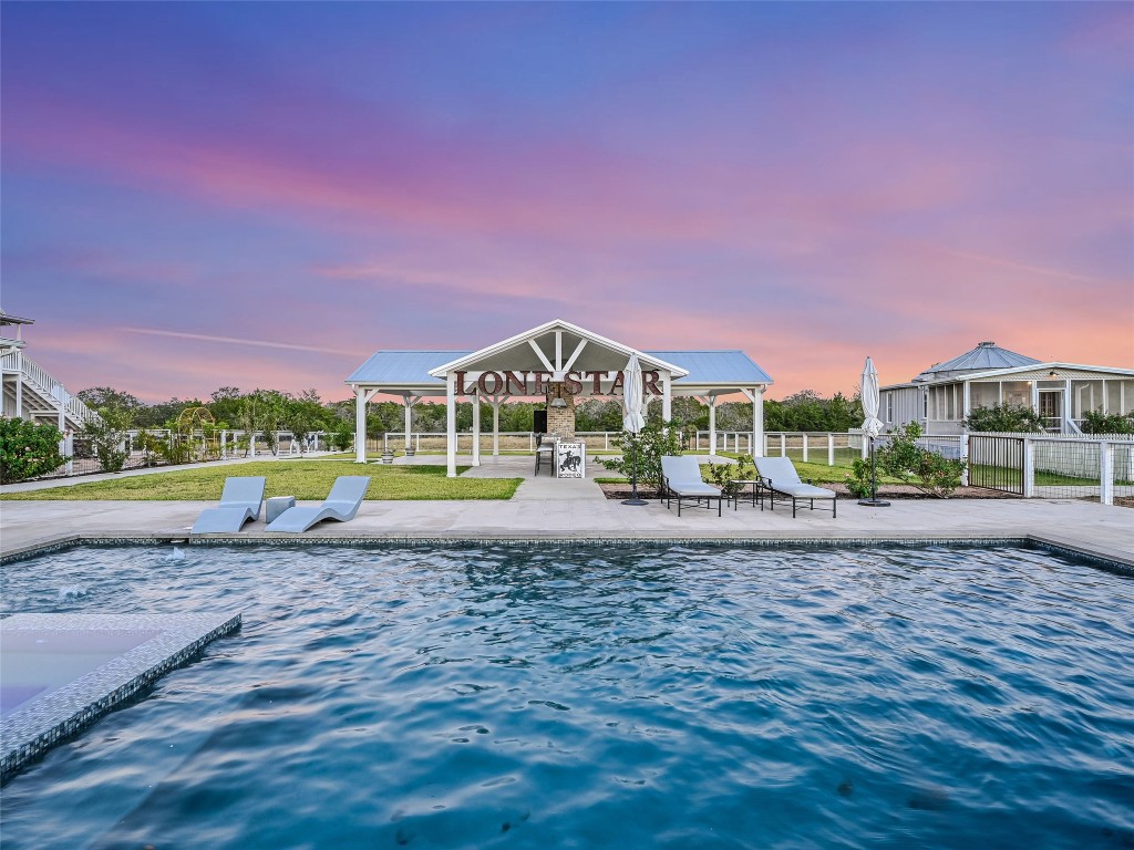 314 Big Sky Ranch Road Smithville, TX 78957 - Photo 26 of 40 a view of a house with a yard and potted plants
