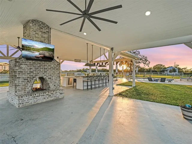 a view of a house with a yard and sitting area