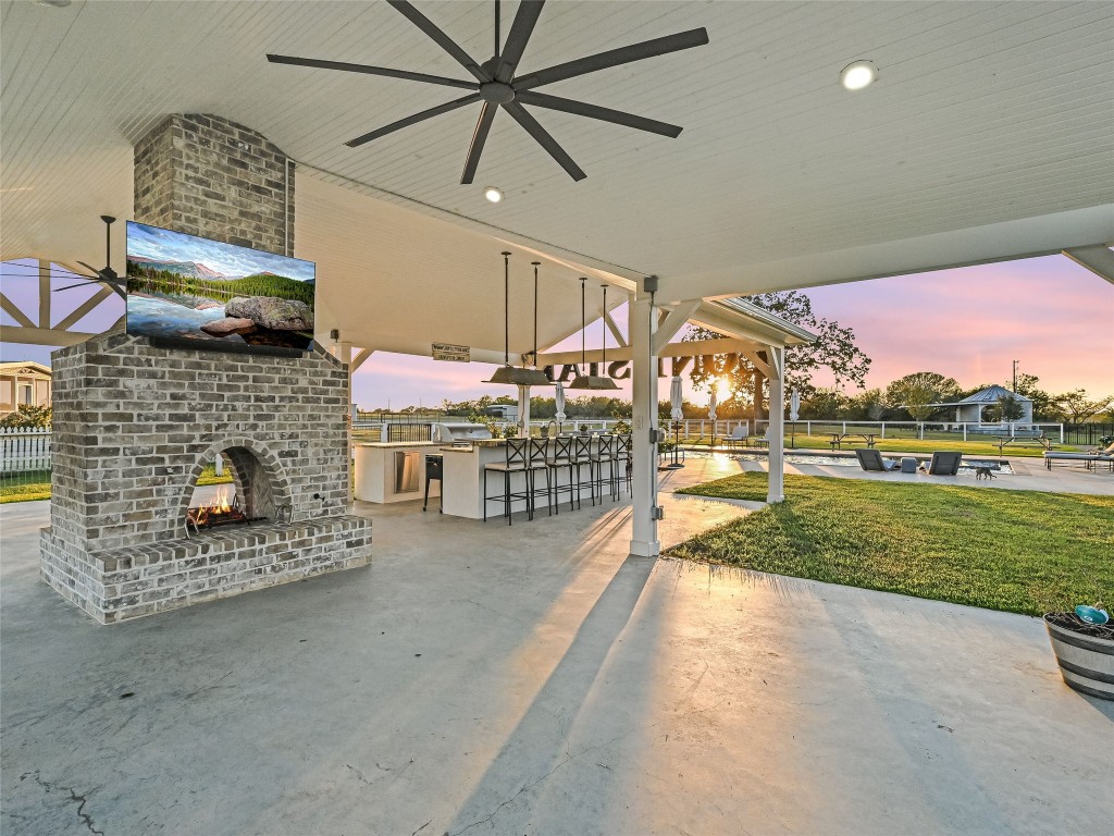 314 Big Sky Ranch Road Smithville, TX 78957 - Photo 27 of 40 a view of a porch with furniture and a fireplace