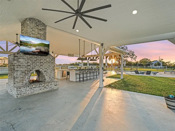 a view of a house with a yard and sitting area