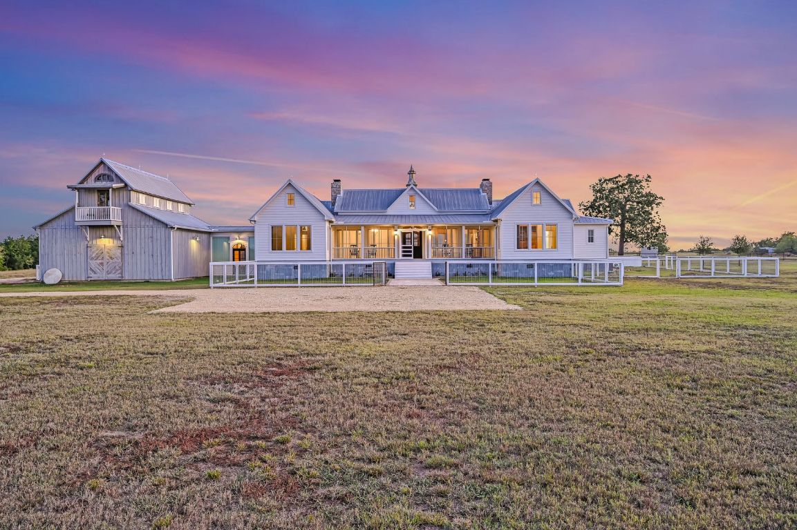 314 Big Sky Ranch Road Smithville, TX 78957 - Photo 5 of 40 a front view of a house with a yard