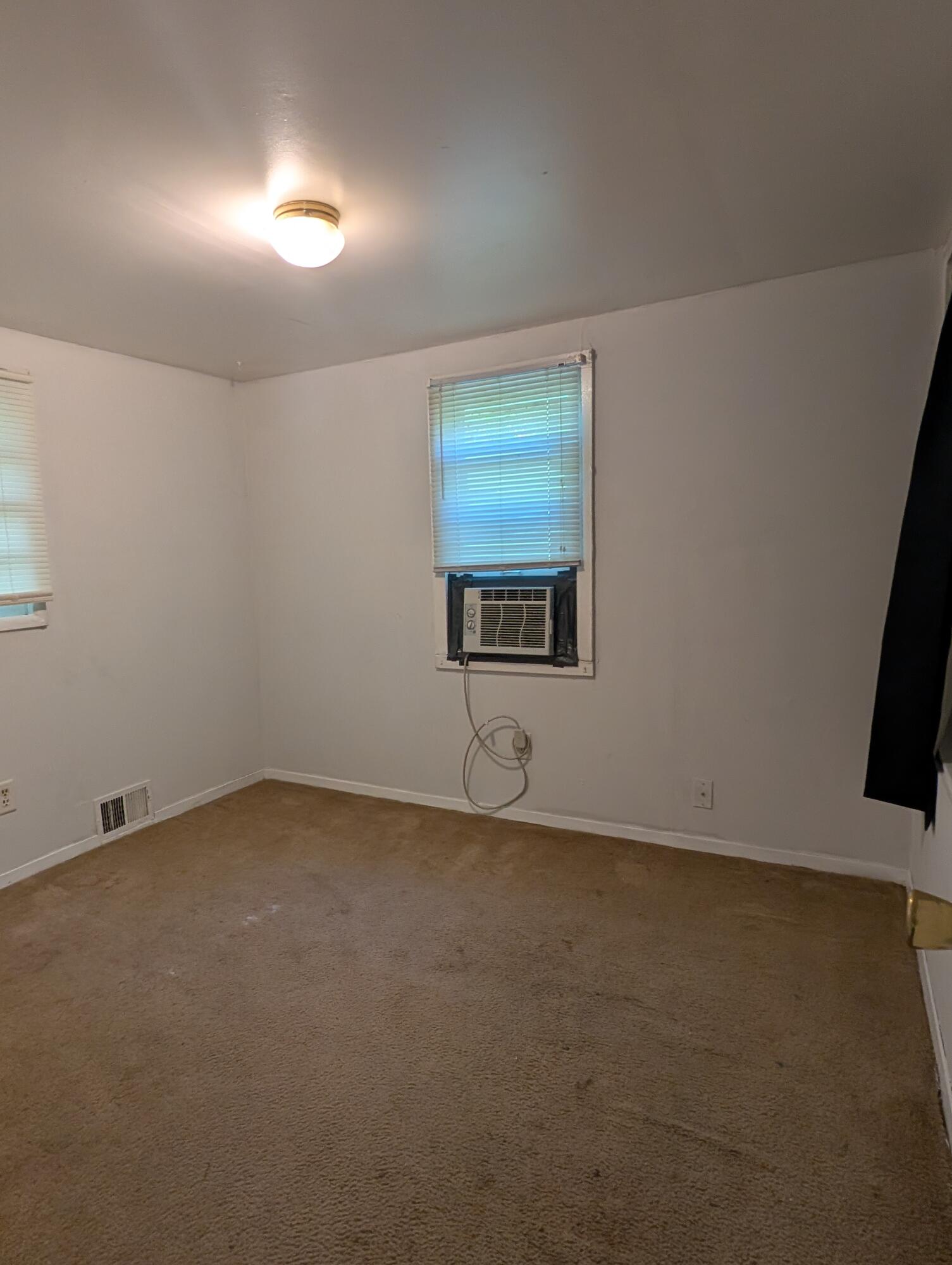 1910 South Calhoun Street Griffith, IN 46319 - Photo 5 of 19 an empty room with a window