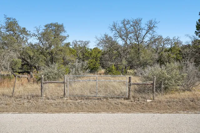 an aerial view of houses with yard