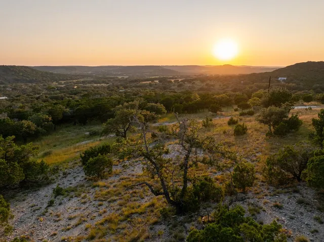 a view of a house with a mountain in the background