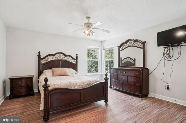 a bedroom with a bed and a walk in closet