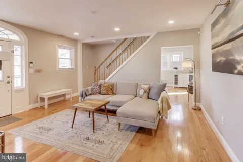 a living room with furniture and a rug
