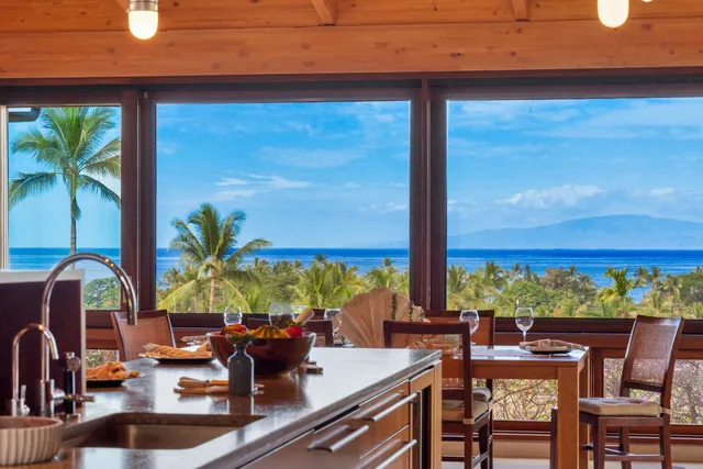 a living room with furniture a large window with outer view