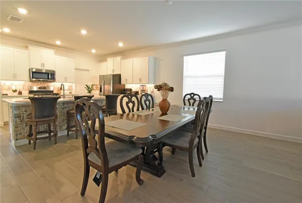 a view of a dining room with furniture