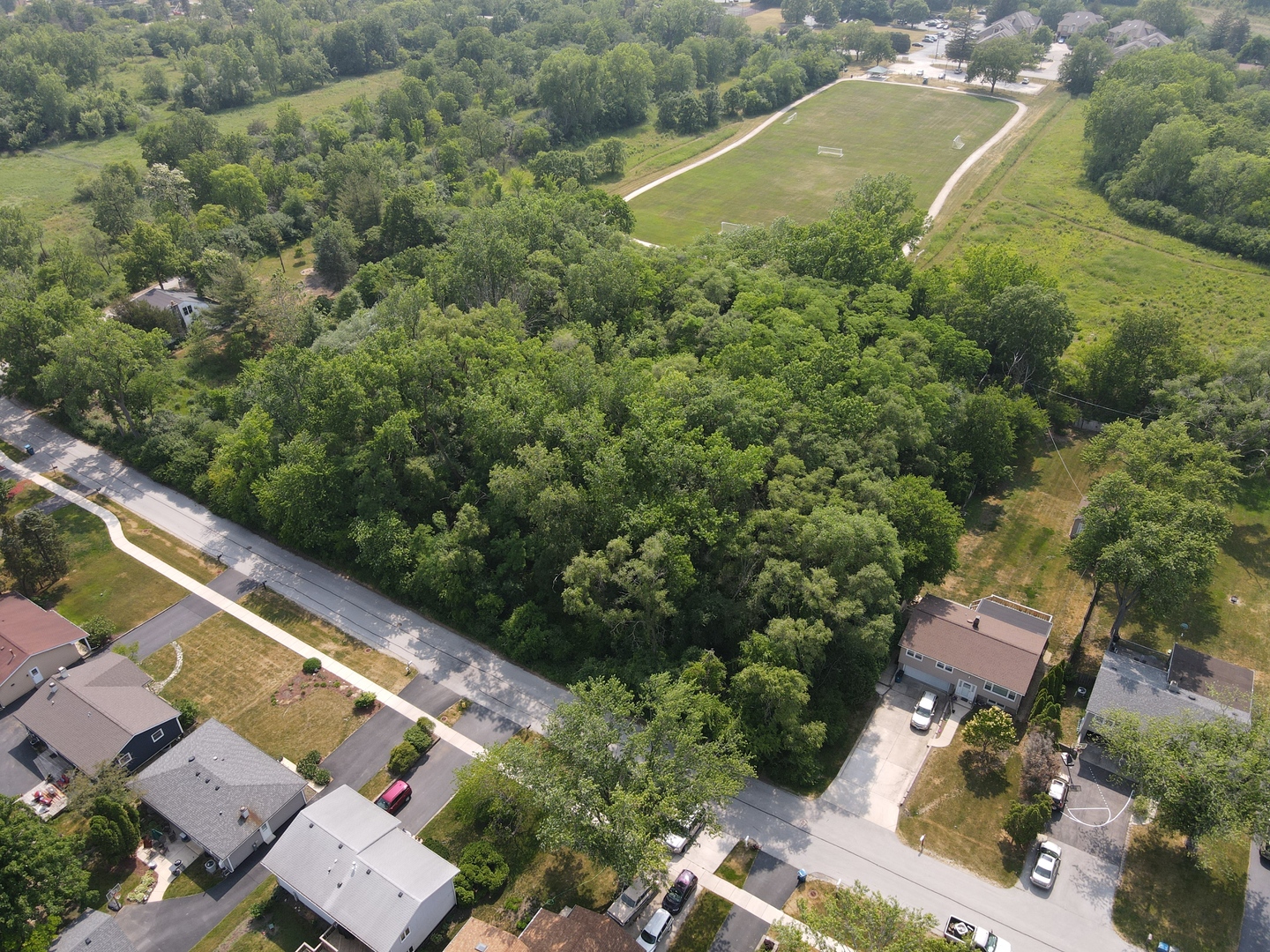 Lot 7 Drendel Road Downers Grove, IL 60516 - Photo 2 of 5 an aerial view of residential houses with outdoor space and trees