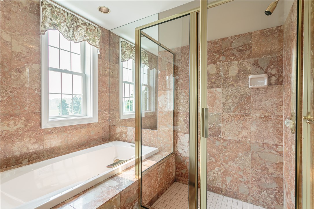 445 5 Points Road Rush, NY 14543 - Photo 17 of 40 Owners' bath with whirlpool tub and shower boasts