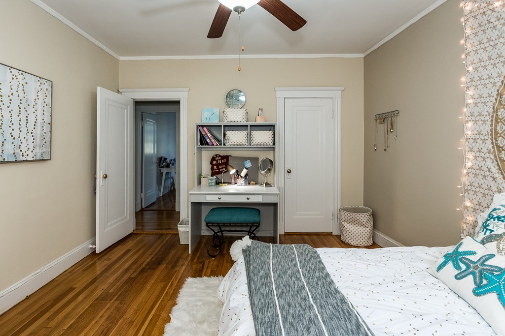 1982 Commonwealth Avenue, Unit 4 Boston, MA 02135 - Photo 16 of 17 a bedroom with a bed and a table