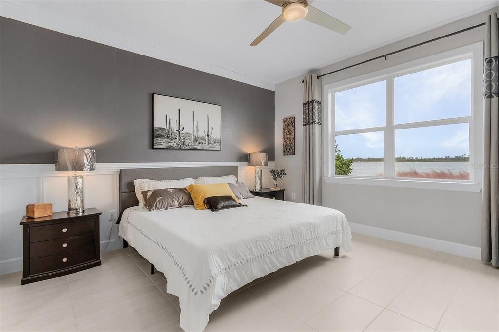 42211 Edgewater Drive Punta Gorda, FL 33982 - Photo 11 of 36 a bedroom with a bed and a window