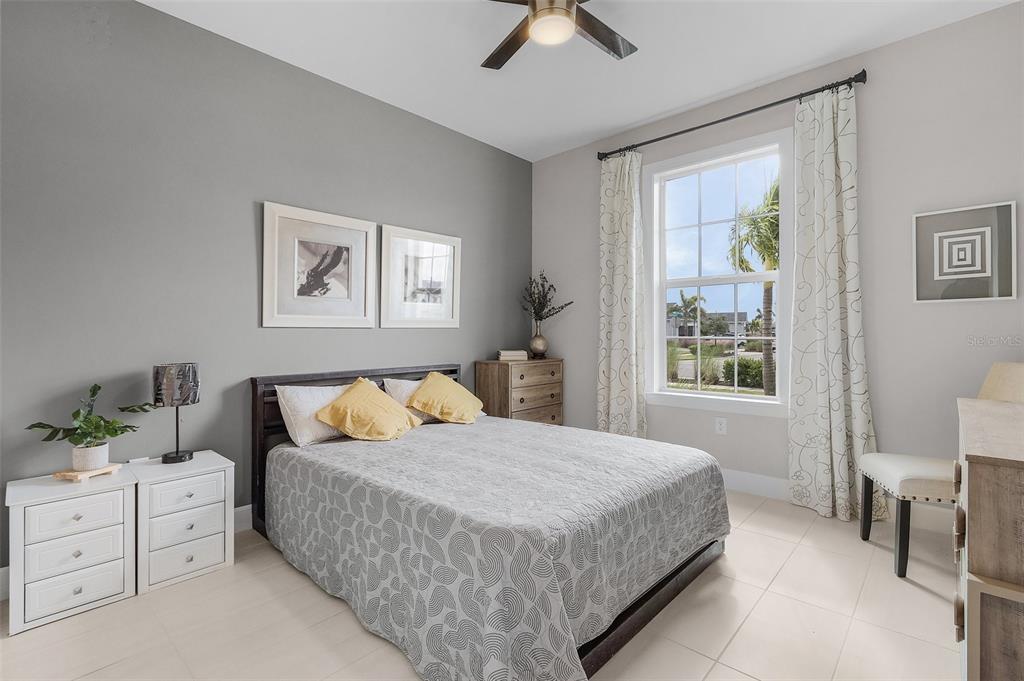 42211 Edgewater Drive Punta Gorda, FL 33982 - Photo 15 of 36 a bedroom with a bed and a painting on the wall