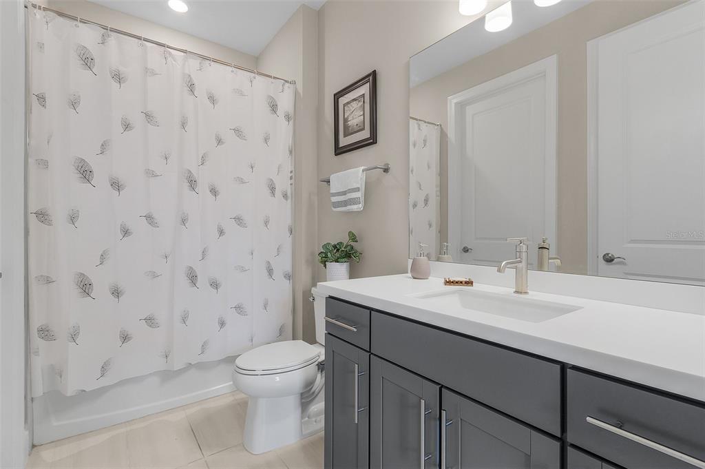 42211 Edgewater Drive Punta Gorda, FL 33982 - Photo 16 of 36 a bathroom with a sink a toilet and shower