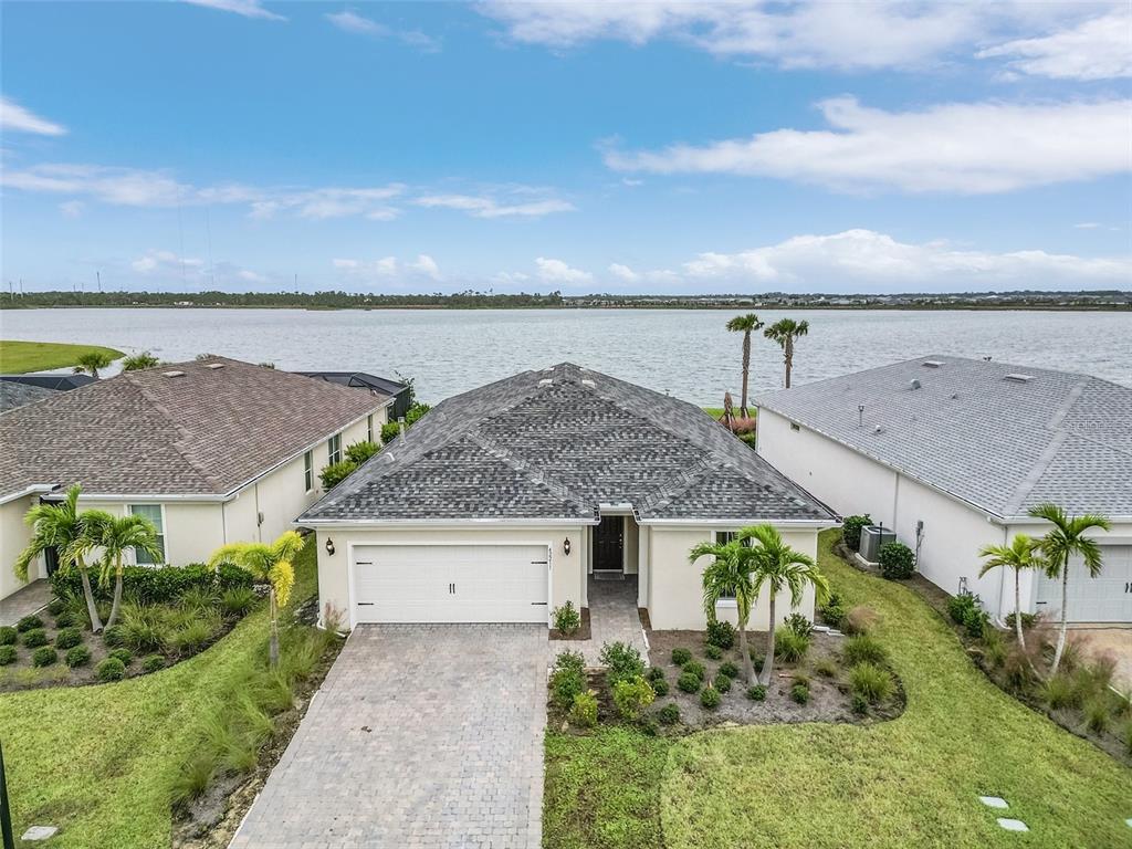 42211 Edgewater Drive Punta Gorda, FL 33982 - Photo 23 of 36 an aerial view of a house with a garden and lake view