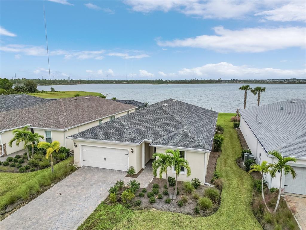 42211 Edgewater Drive Punta Gorda, FL 33982 - Photo 25 of 36 an aerial view of a house with a garden and lake view