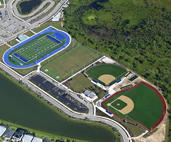 42211 Edgewater Drive Punta Gorda, FL 33982 - Photo 33 of 36 an aerial view of a tennis ground and a residential houses