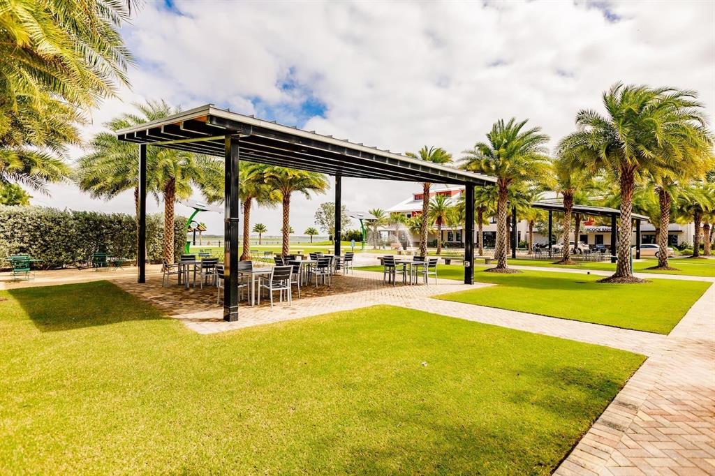42211 Edgewater Drive Punta Gorda, FL 33982 - Photo 35 of 36 a view of swimming pool with outdoor seating and garden