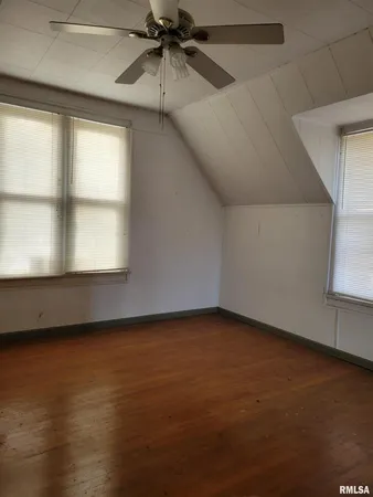 a kitchen with a stove a sink and a microwave