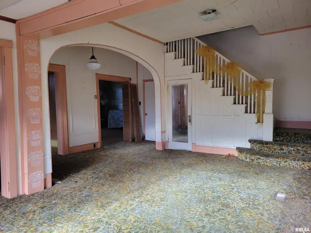 a view of a hallway with staircase