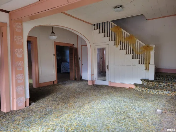 a view of a hallway with staircase