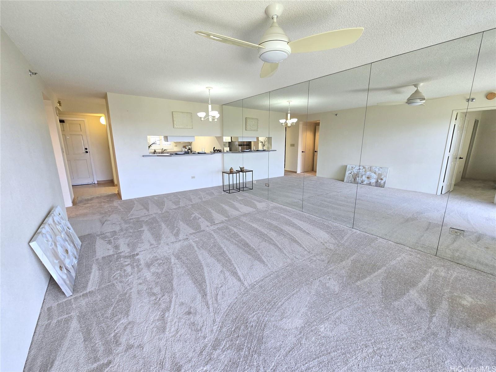3075 Ala Poha Place, Unit 1504 Honolulu, HI 96818 - Photo 13 of 22 a view of a kitchen with a sink and a refrigerator