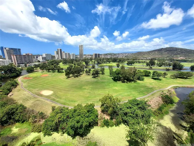 a view of a golf course with green space