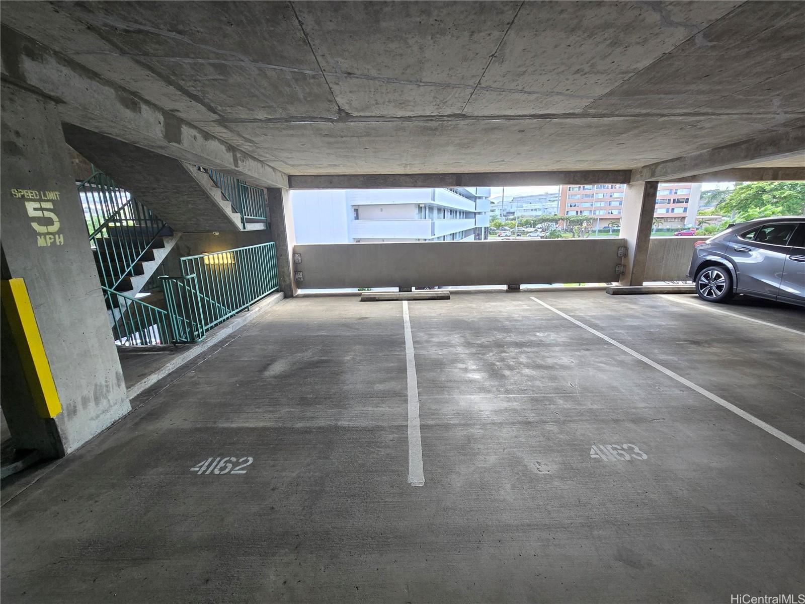 3075 Ala Poha Place, Unit 1504 Honolulu, HI 96818 - Photo 19 of 22 a view of a car parking garage
