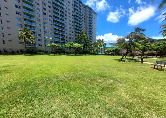 a view of a field with sitting area