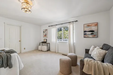 a bedroom with bed and a window