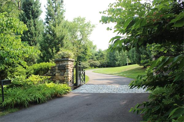 174 Highland Street Weston, MA 02493 - Photo 2 of 29 a view of street with houses in background