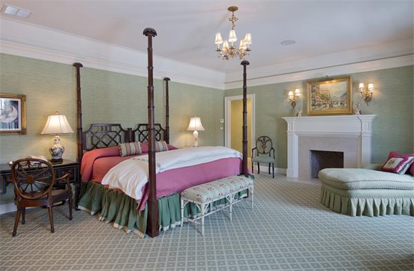 174 Highland Street Weston, MA 02493 - Photo 22 of 29 a bedroom with a bed and a chandelier
