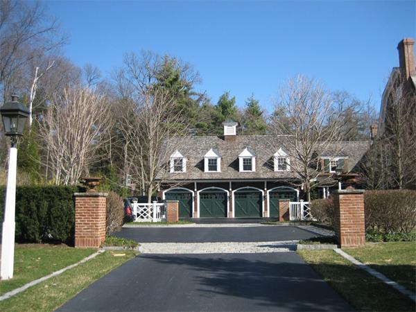 174 Highland Street Weston, MA 02493 - Photo 27 of 29 a front view of a house with a garden