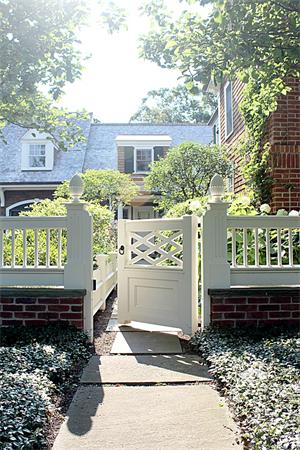 174 Highland Street Weston, MA 02493 - Photo 28 of 29 a view of a house with a yard and a wooden fence