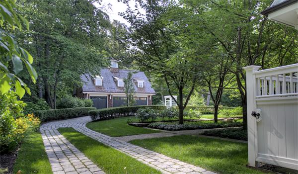 174 Highland Street Weston, MA 02493 - Photo 5 of 29 a front view of a house with a yard