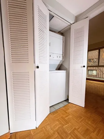 a open kitchen with a sink and cabinets